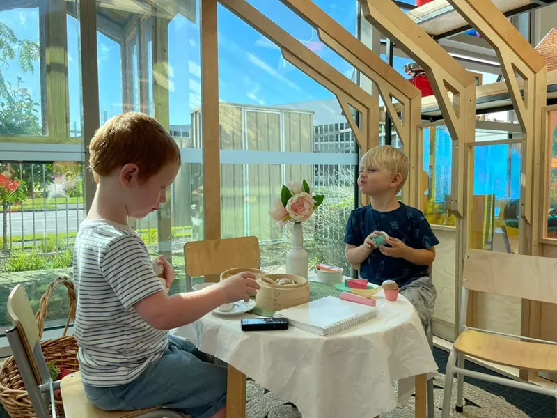 boys playing at family corner