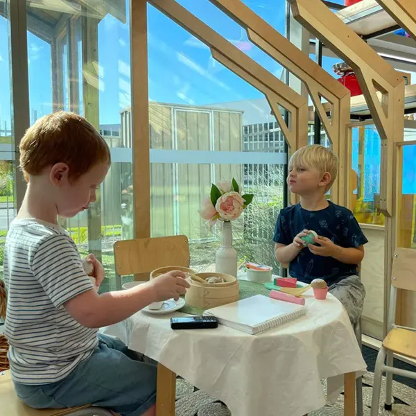 boys playing at family corner