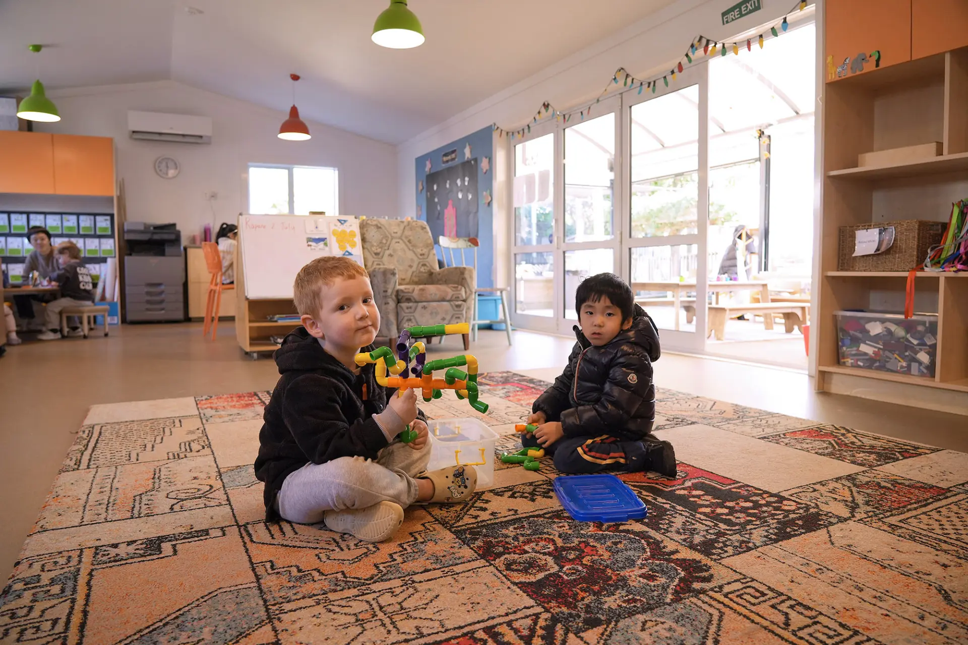 ellerslie village boys playing mat learning