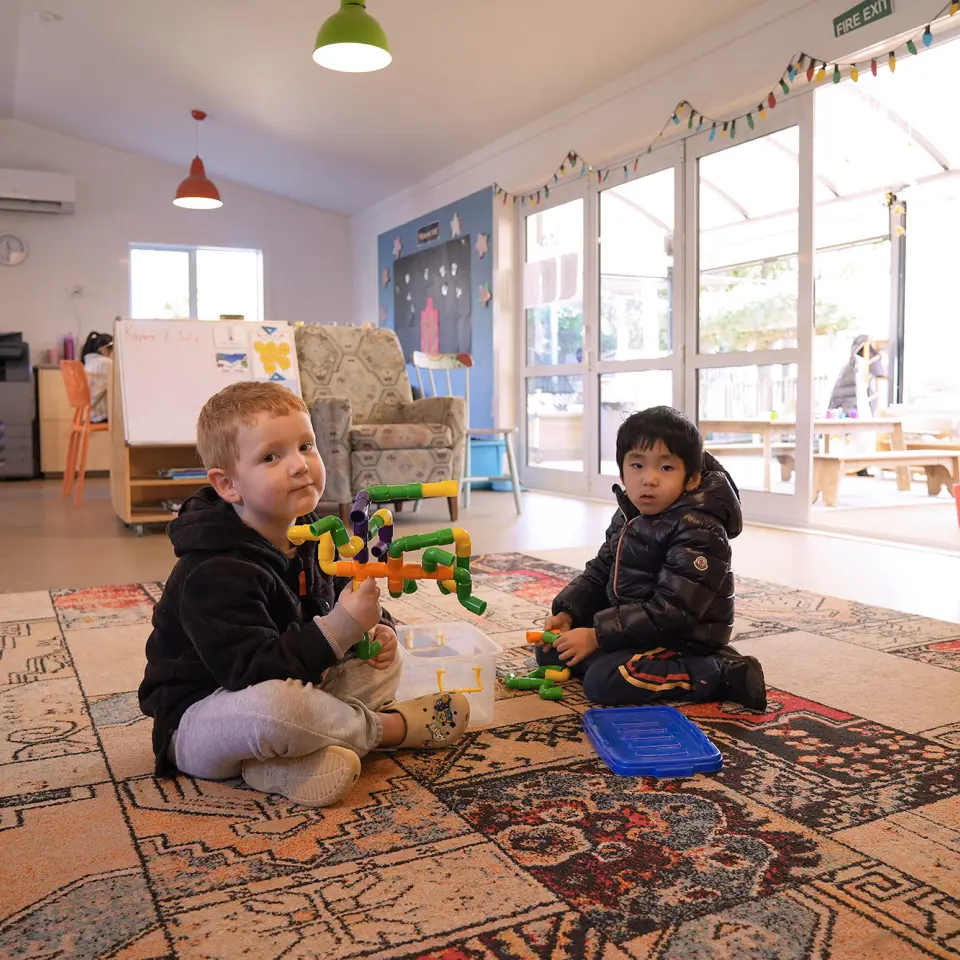 ellerslie village boys playing mat learning