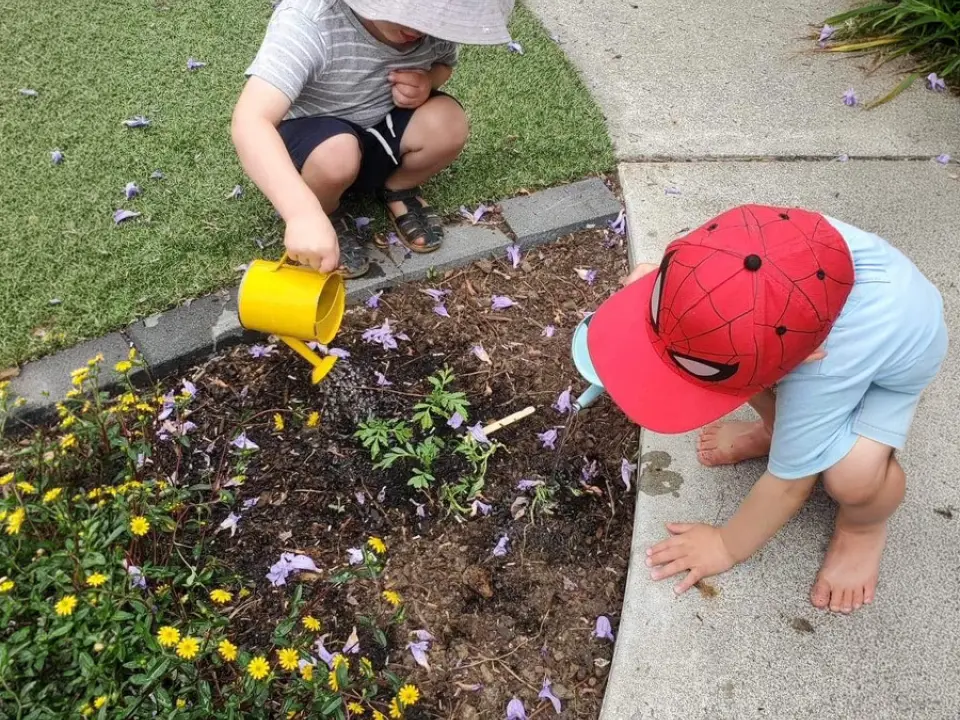 boys helping gardening at Preschool wide