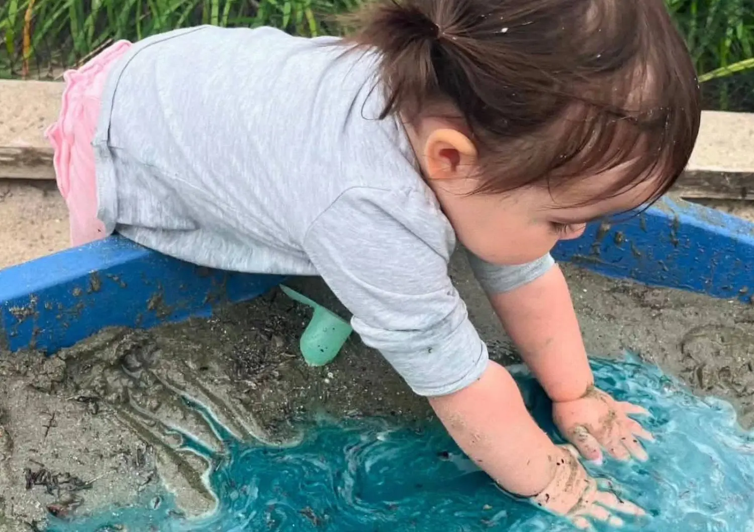 little girl playing sandpit
