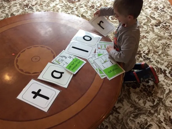 kid playing with literacy at Ellerslie